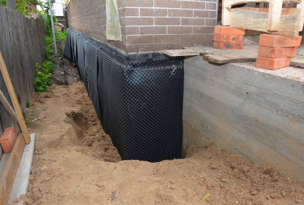 Happy homeowners after waterproofing job in Abington